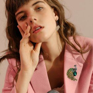 A stylish old peacock brooch